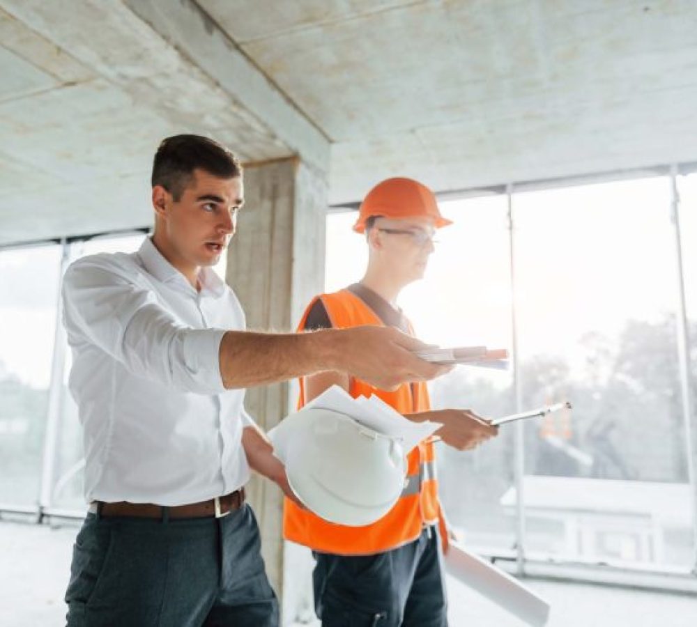 planning-the-process-man-in-suit-and-handyman-in-VES4UUP-768x512